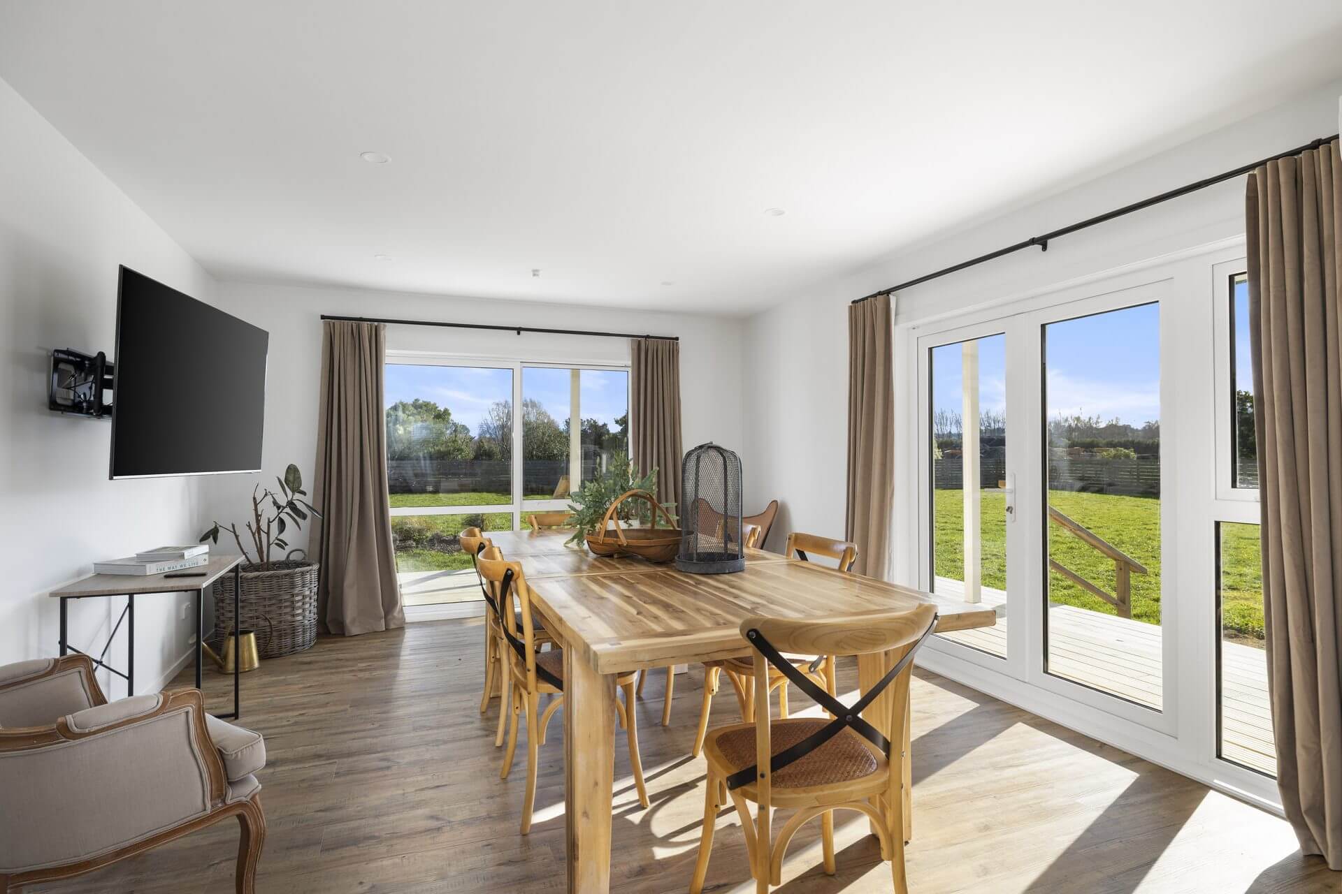 Renovated dining room large double sliding doors leading to deck