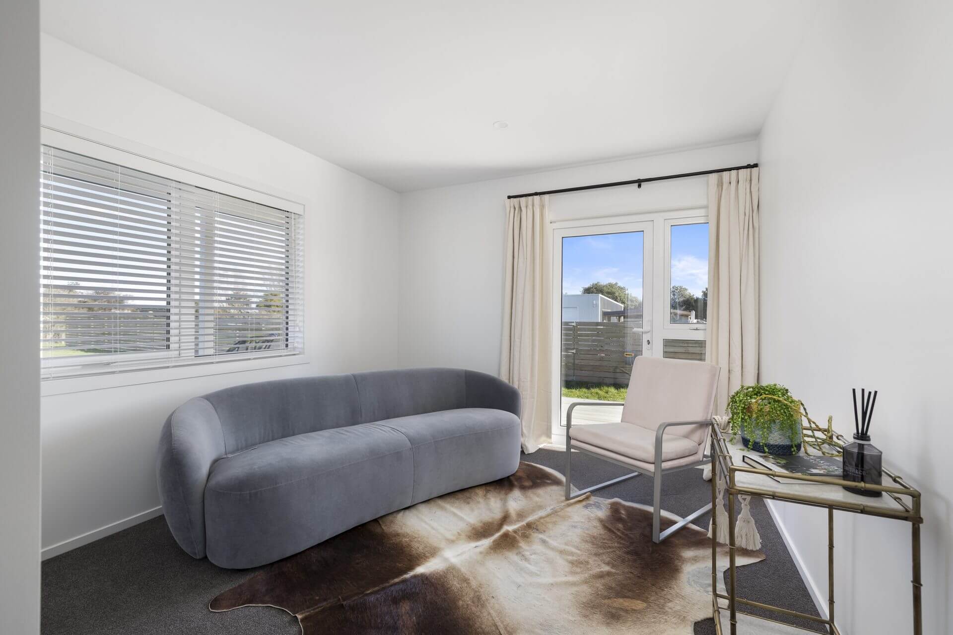 Small extra living area recently renovated with glass window door leading out to deck