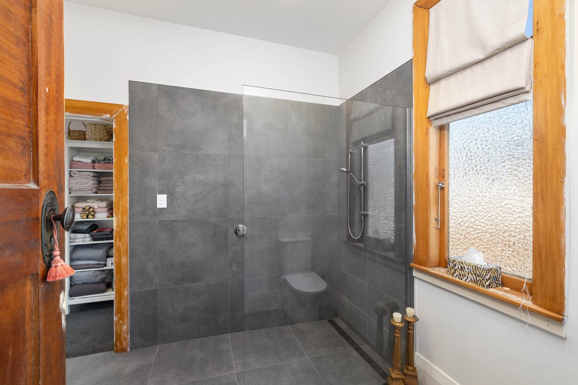 Character cottage ensuite renovation with modern large dark grey slate looking tiles