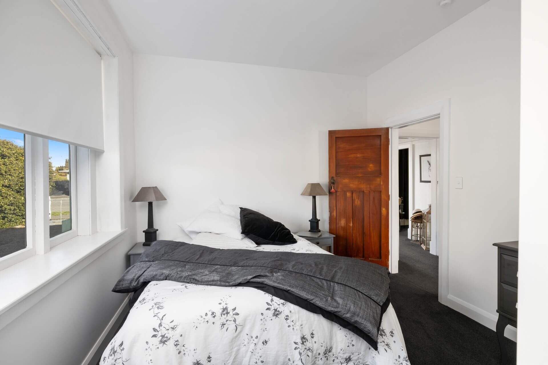 Character coattage bedroom renovated with modern white finish